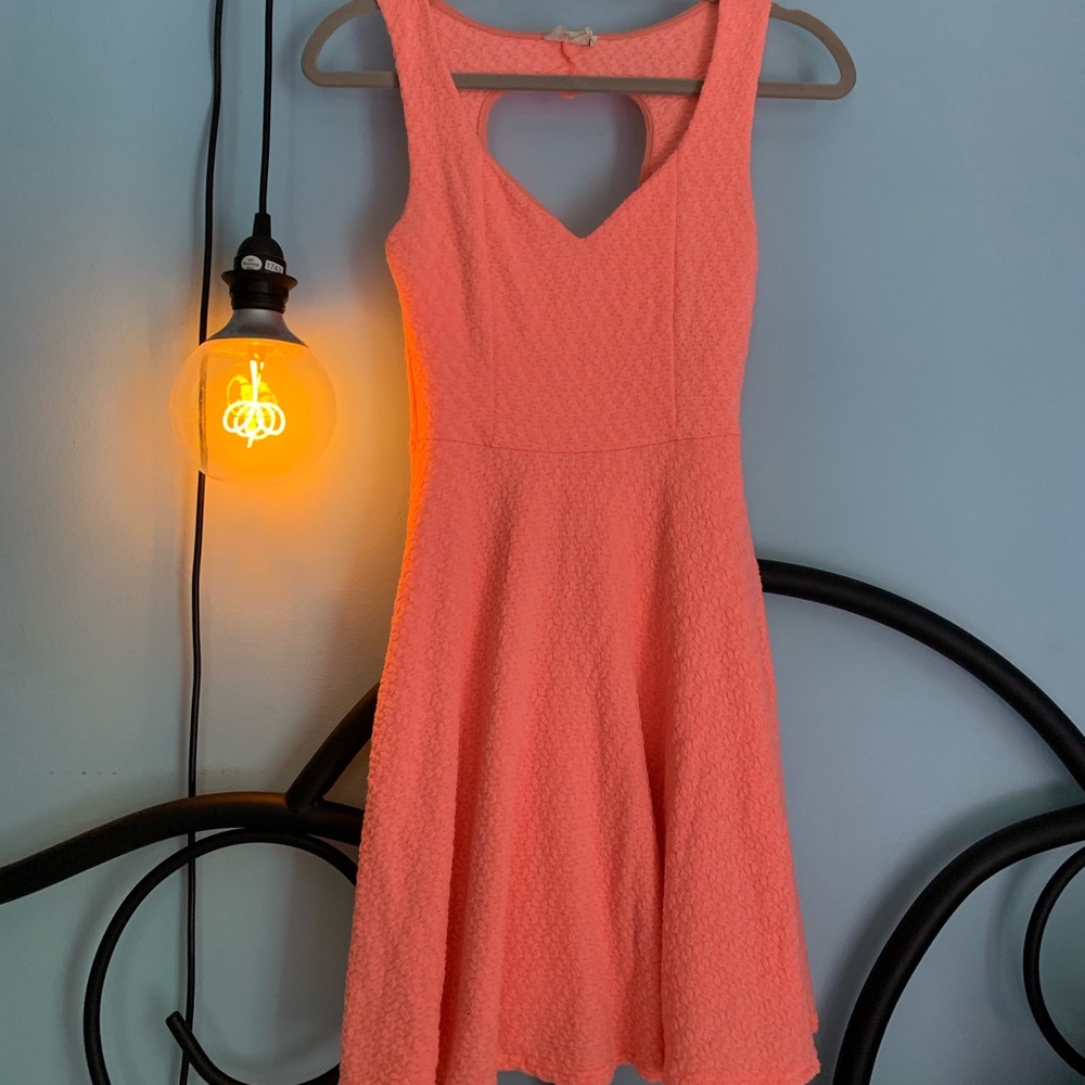 coral skater dress with heart cutout